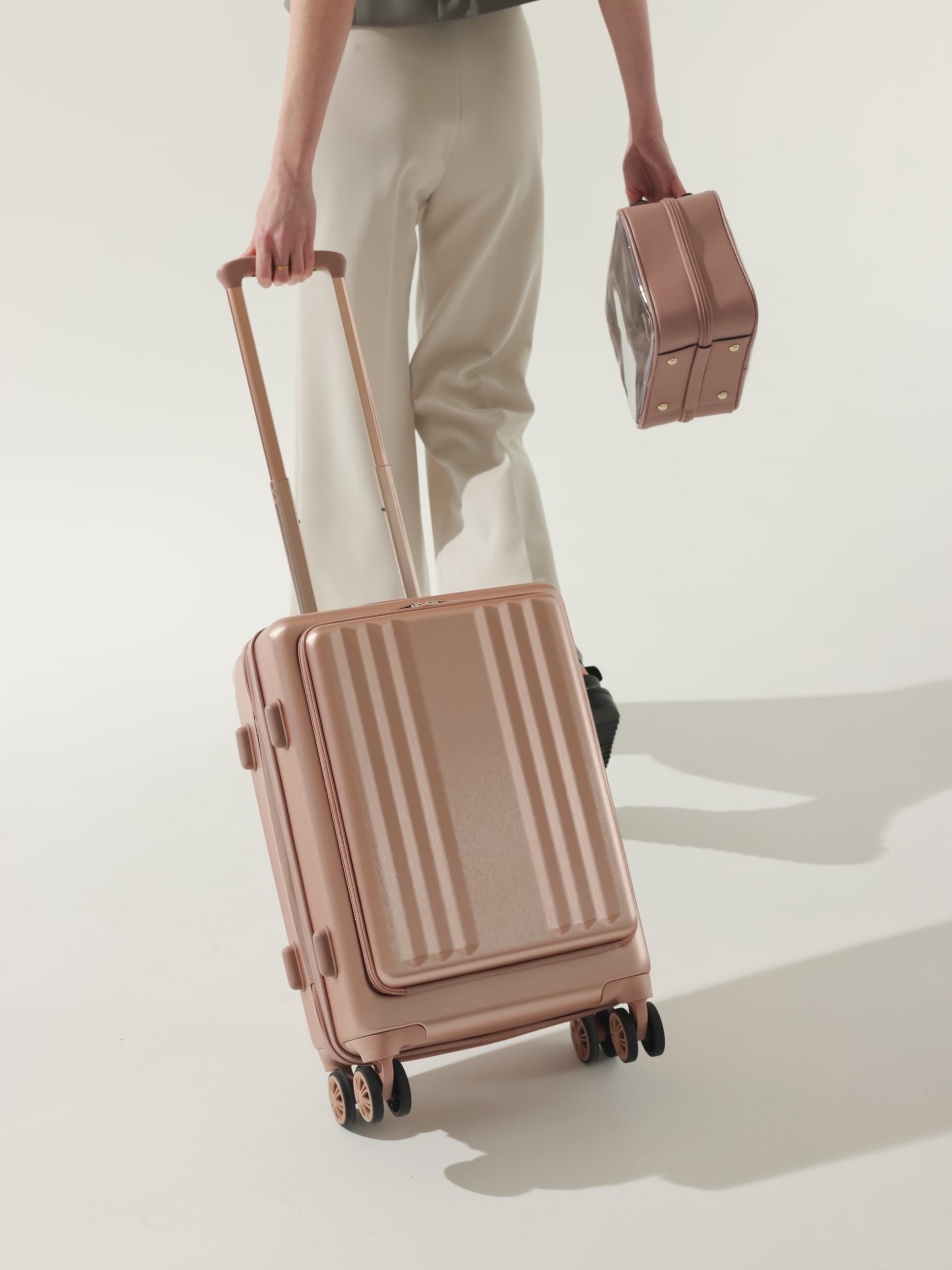 AMBUER-FRONT-POCKET-CARRY-ON_ROSE-GOLD-LIFESTYLE1_6af1d0fc-4278-4ebb-b5c9-6f1fa0dd2104.jpg