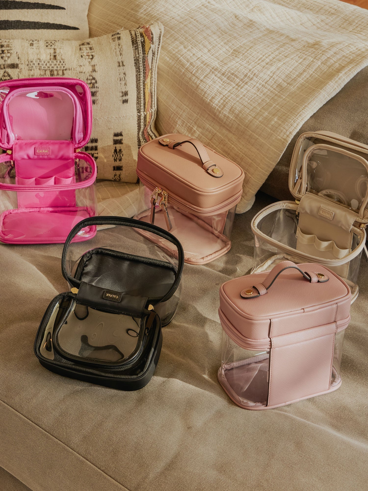 CLEAR-TRAIN-CASE-WITH-TOP-COMPARTMENT-LIFESTYLE2_2d175205-4533-43d4-a6dc-f61cc7c5ca28.jpg