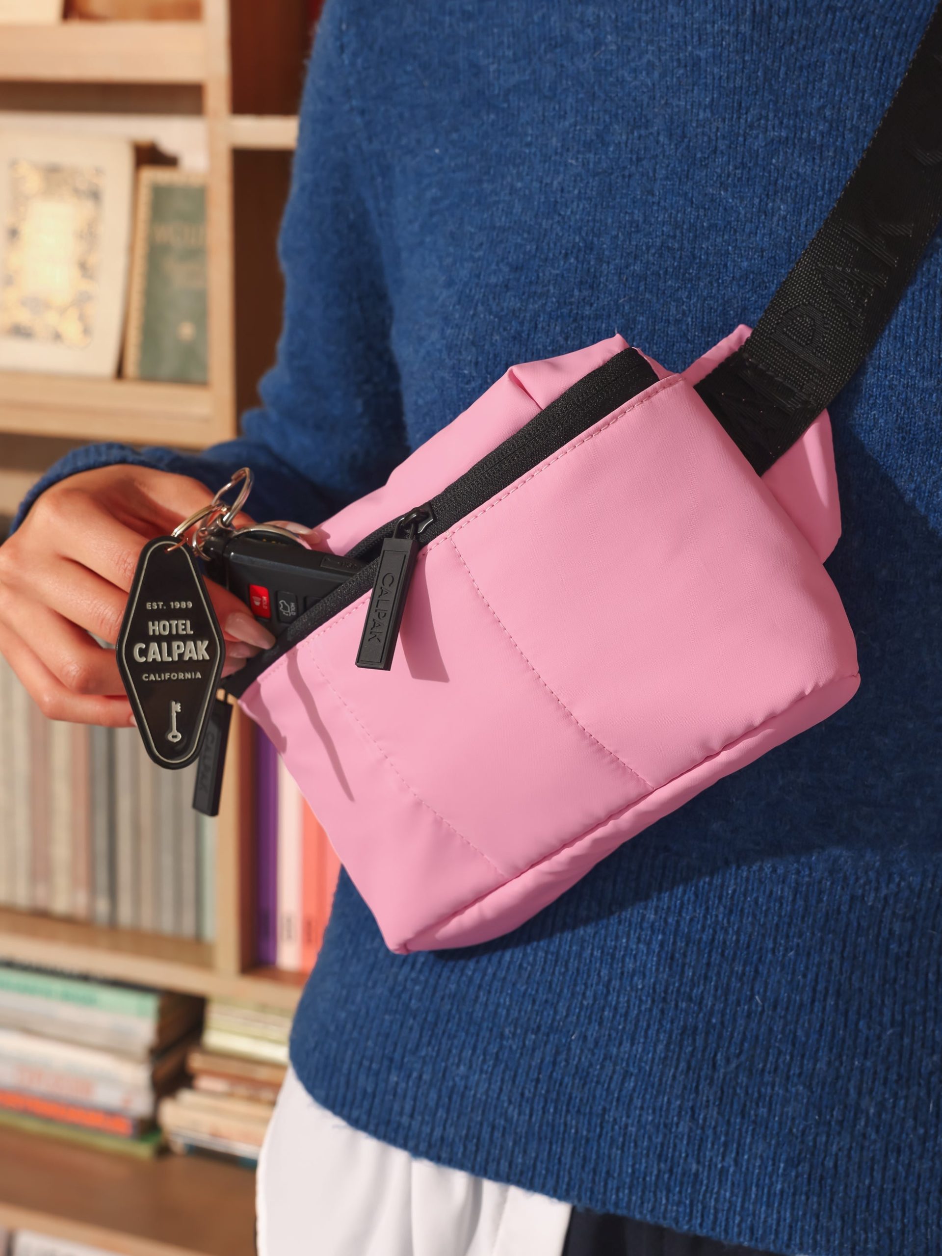 LUKA-MINI-BELT-BAG_BUBBLEGUM-LIFESTYLE1_a7a05c85-6966-43bf-b925-3f29e43c29eb.jpg