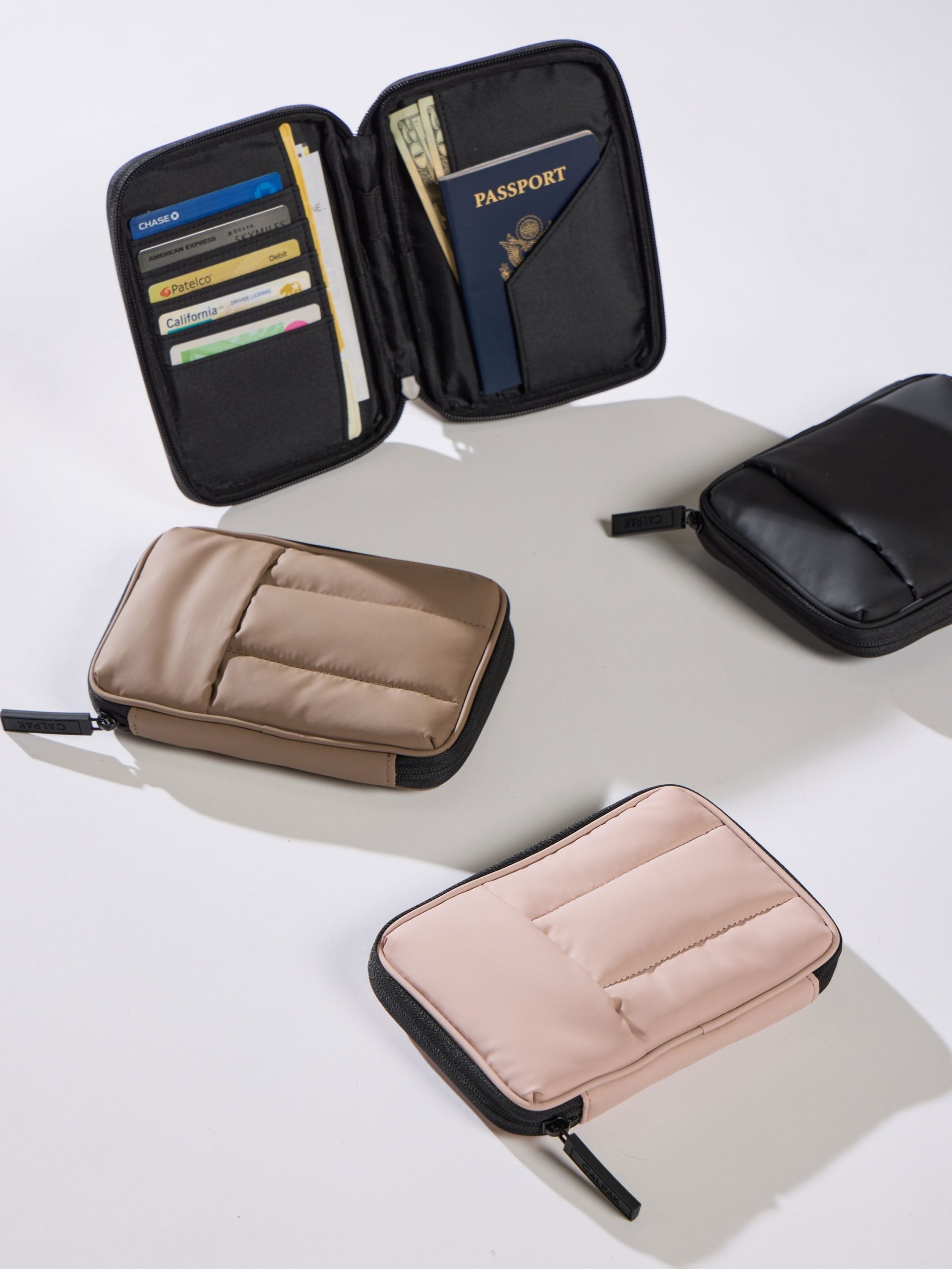 LUKA-ZIPPERED-PASSPORT-WALLET-CHOCOLATE-LIFESTYLE1_b1300d22-1a26-4244-86c7-c91d430f02a3.jpg