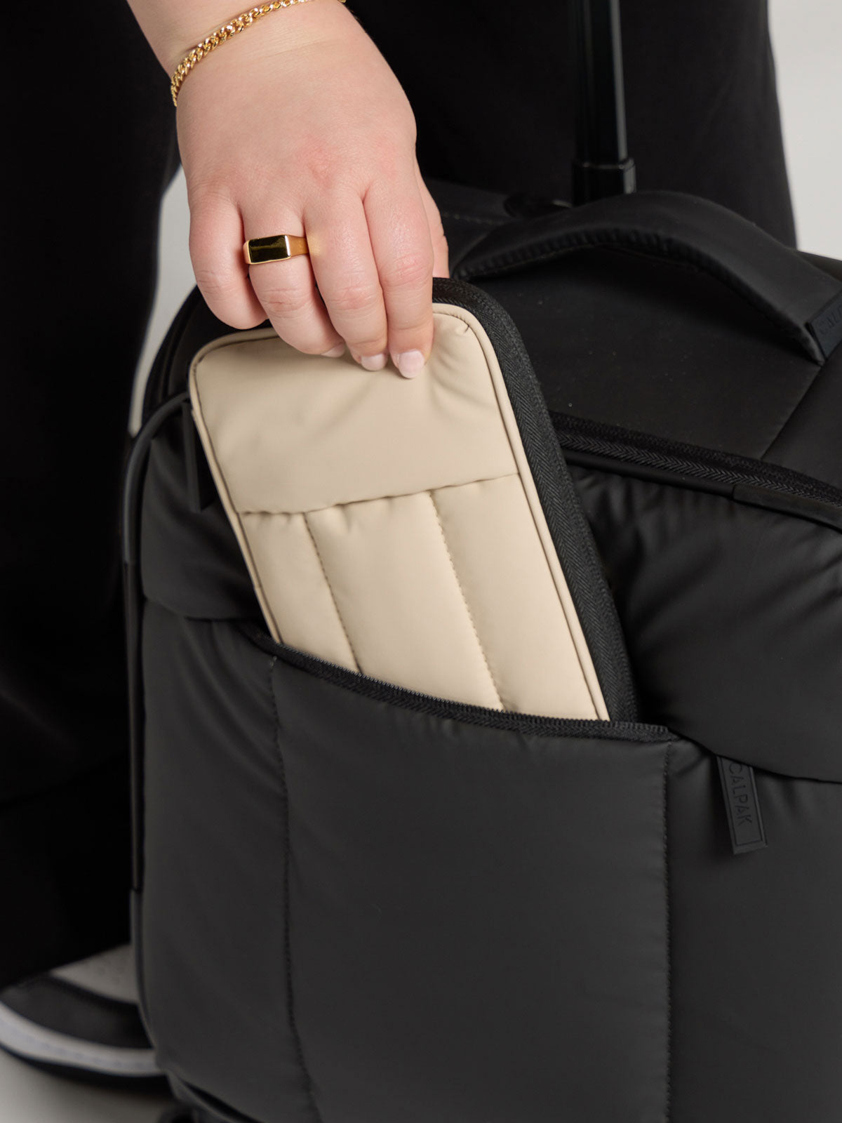 LUKA-ZIPPERED-PASSPORT-WALLET-OATMEAL-LIFESTYLE1_9e342e90-576e-49d7-9403-5b4ab128590b.jpg