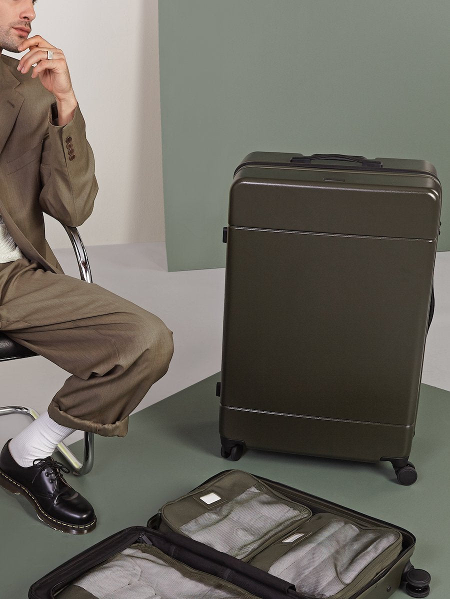 hue-large-luggage-moss-modelled_04c65285-883f-4144-ba27-faf9a6a3bbd1.jpg