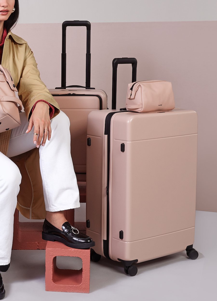 hue-large-luggage-pink-sand-modelled_43007243-2988-4cbb-b315-772d363c52c1.jpg